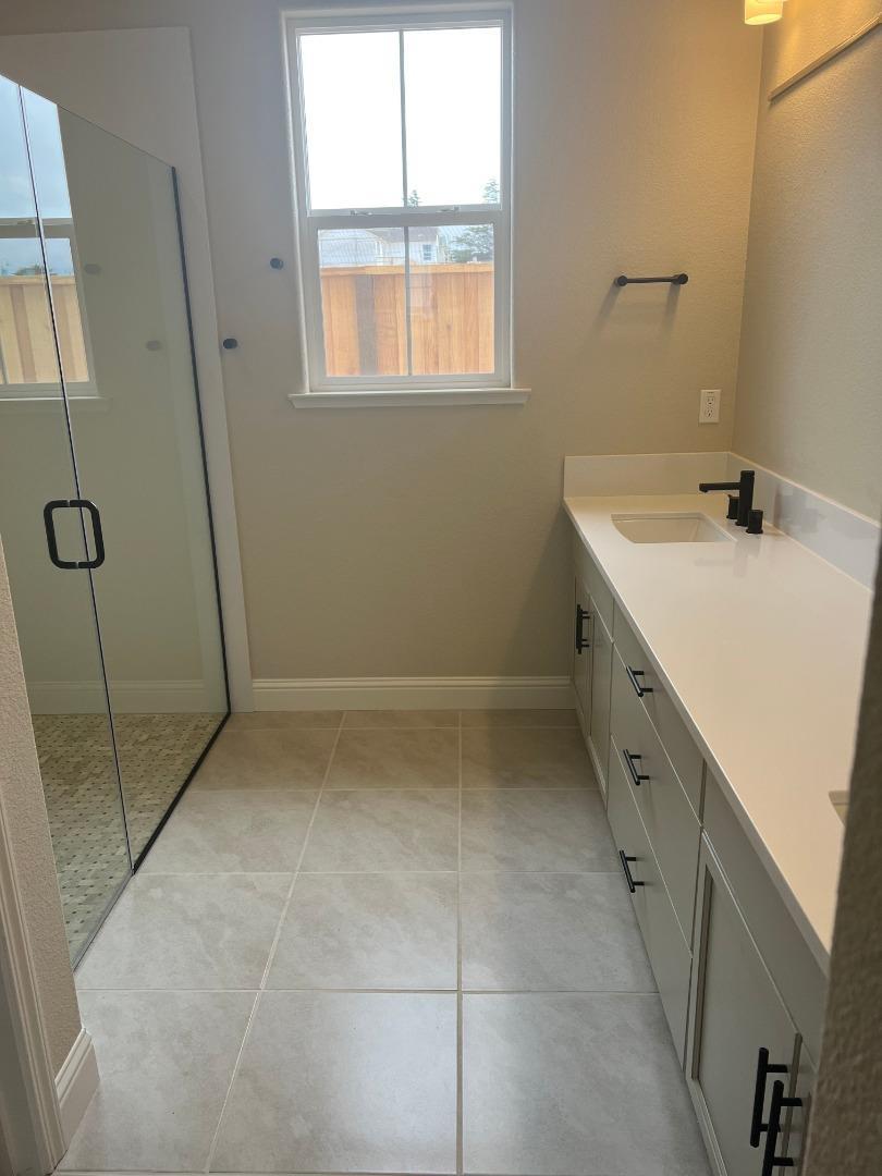 480 Lassen Way Marina, CA 93933 - Photo 8 of 19 a bathroom with a sink a toilet and a shower