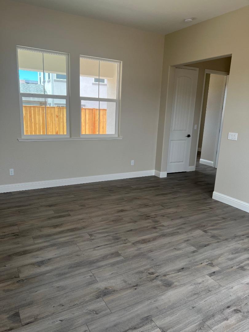 480 Lassen Way Marina, CA 93933 - Photo 10 of 19 a view of an empty room with wooden floor and a window