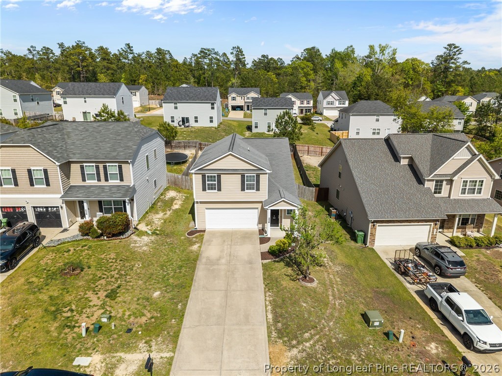 226 River Oak Street Spring Lake, NC 28390 - Photo 5 of 41 an aerial view of a residential apartment building with a yard