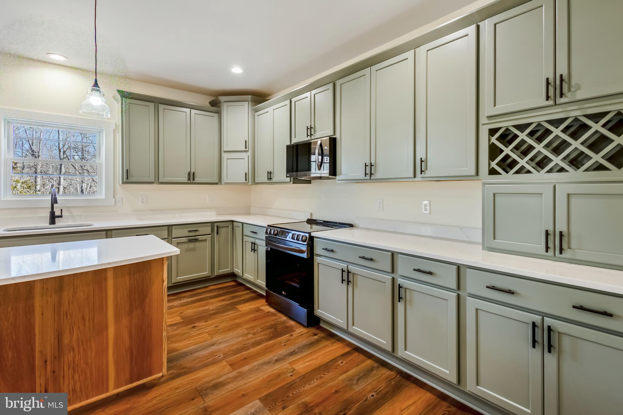 2 Windsor Drive King George, VA 22485 - Photo 13 of 60 a kitchen with stainless steel appliances granite countertop a sink stove and cabinets