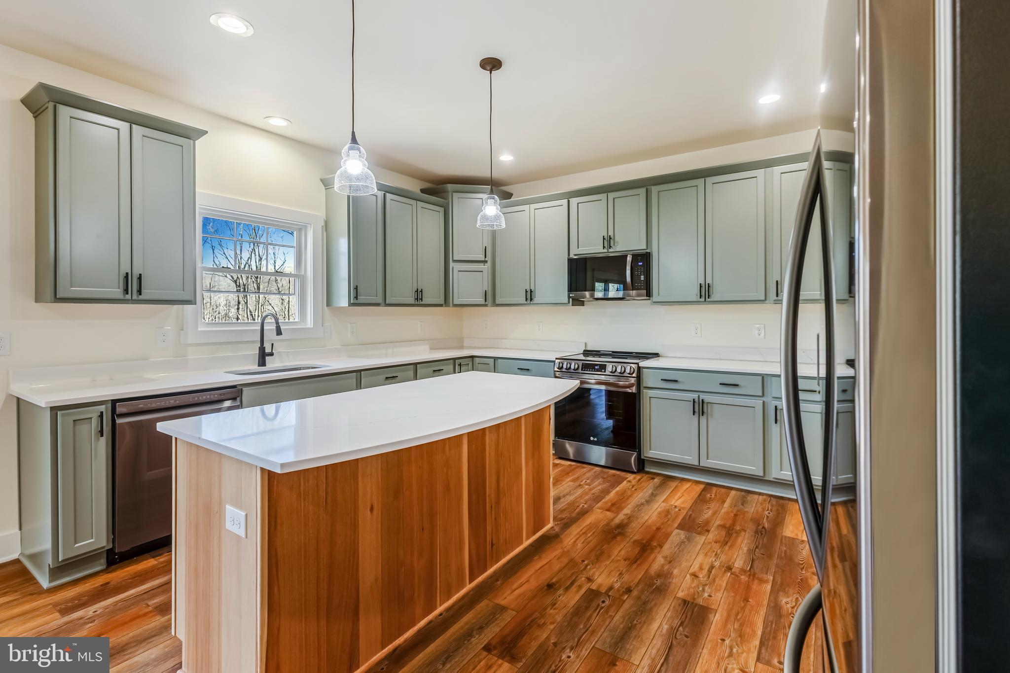 2 Windsor Drive King George, VA 22485 - Photo 16 of 60 a kitchen with stainless steel appliances granite countertop a sink and a stove top oven