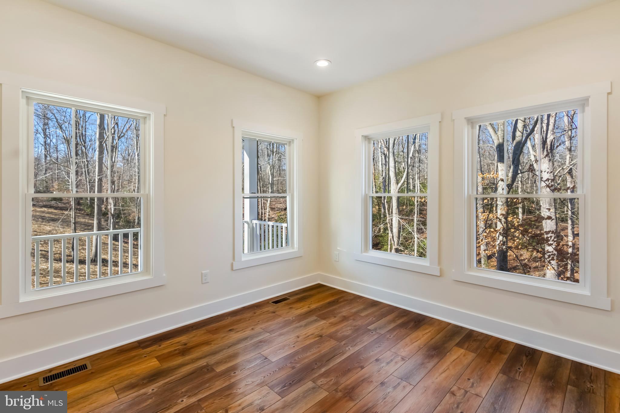 2 Windsor Drive King George, VA 22485 - Photo 20 of 60 a view of an empty room with wooden floor and a window