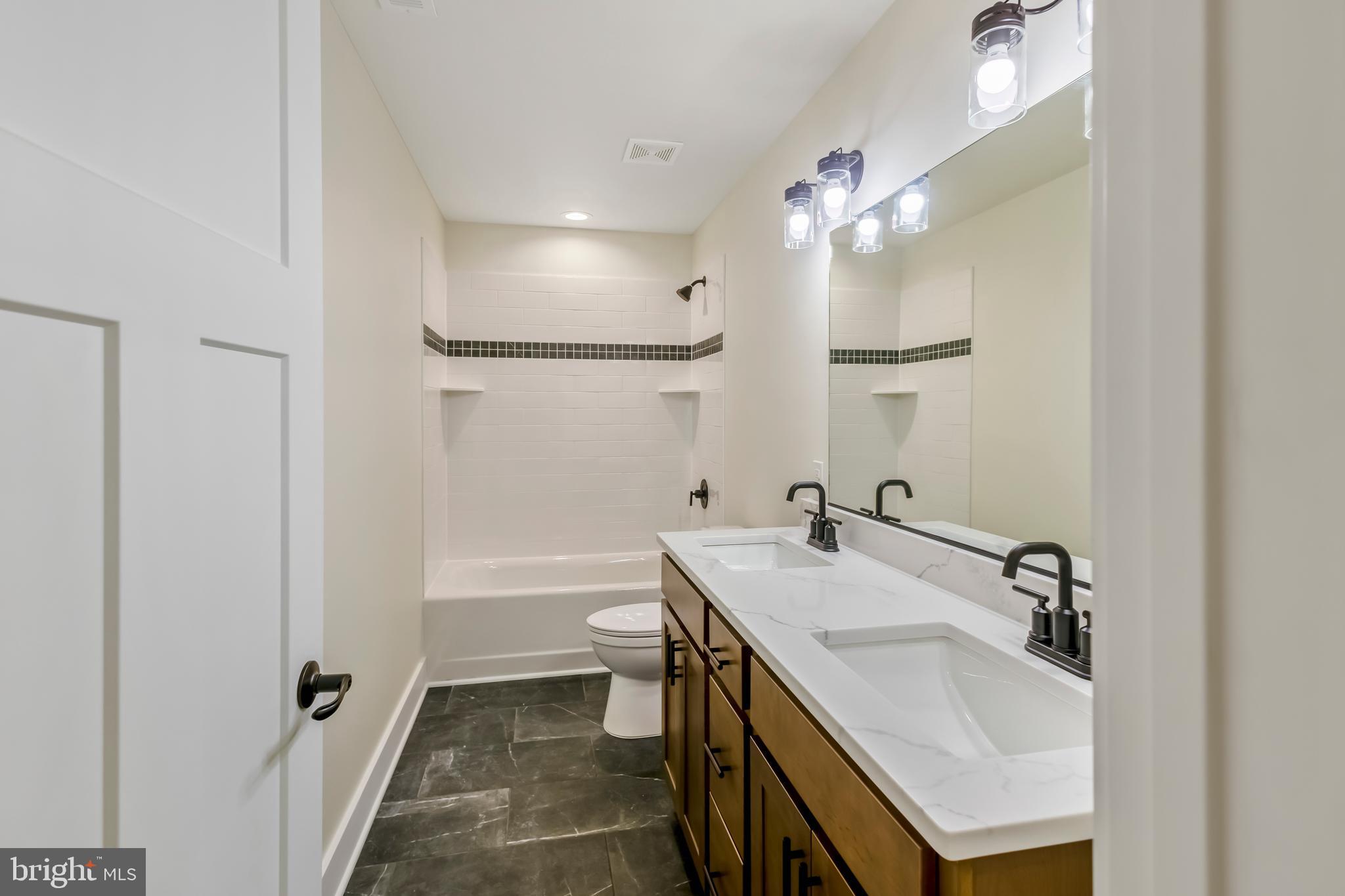 2 Windsor Drive King George, VA 22485 - Photo 32 of 60 a bathroom with a sink and a mirror