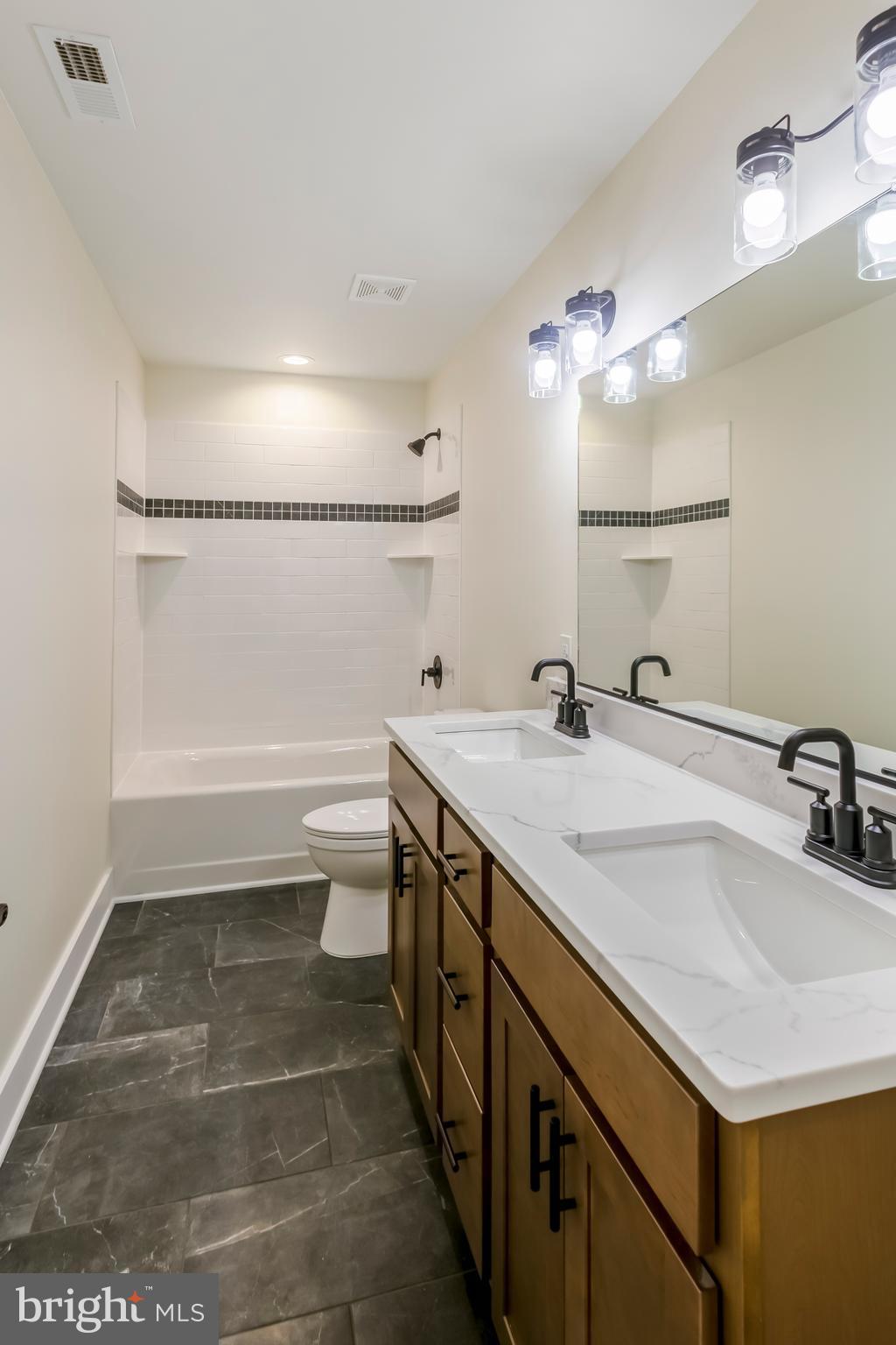 2 Windsor Drive King George, VA 22485 - Photo 33 of 60 a bathroom with a sink a toilet and a mirror