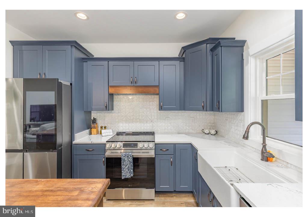 2 Windsor Drive King George, VA 22485 - Photo 47 of 60 a kitchen with stainless steel appliances granite countertop a sink stove and refrigerator