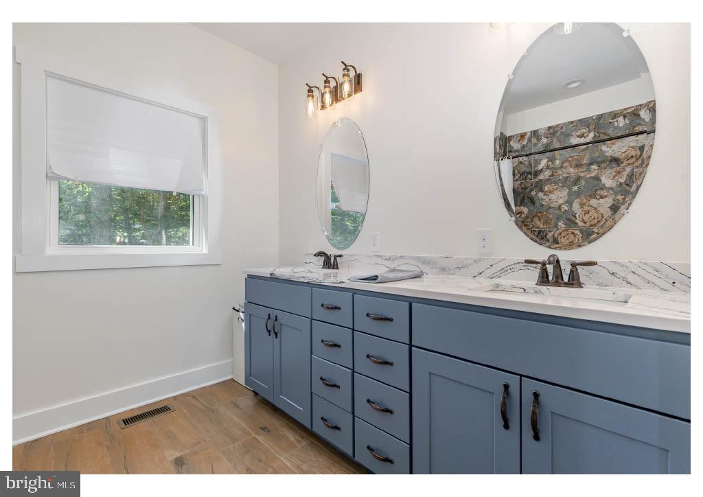 2 Windsor Drive King George, VA 22485 - Photo 54 of 60 a bathroom with a sink and a mirror