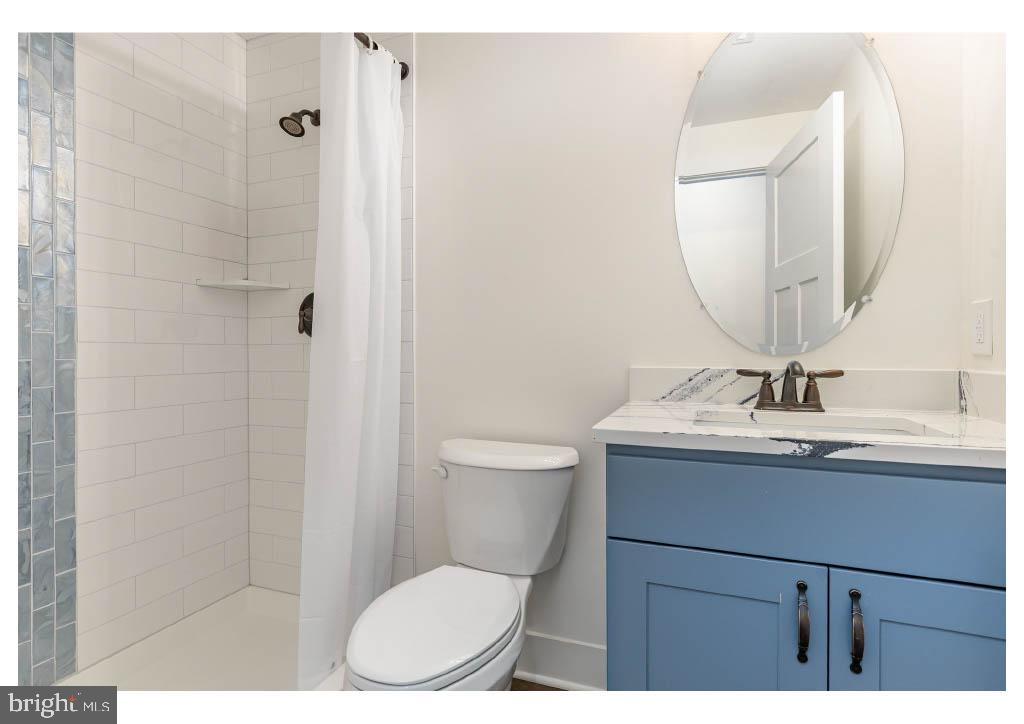 2 Windsor Drive King George, VA 22485 - Photo 56 of 60 a bathroom with a granite countertop sink toilet a mirror and shower