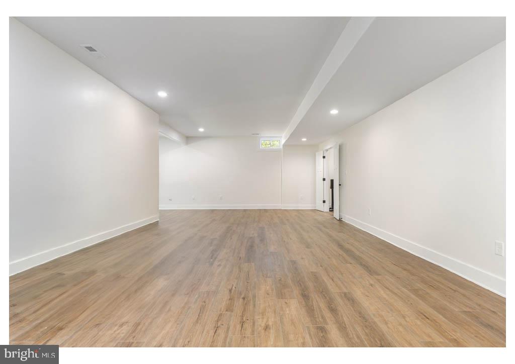 2 Windsor Drive King George, VA 22485 - Photo 58 of 60 a view of an empty room with wooden floor