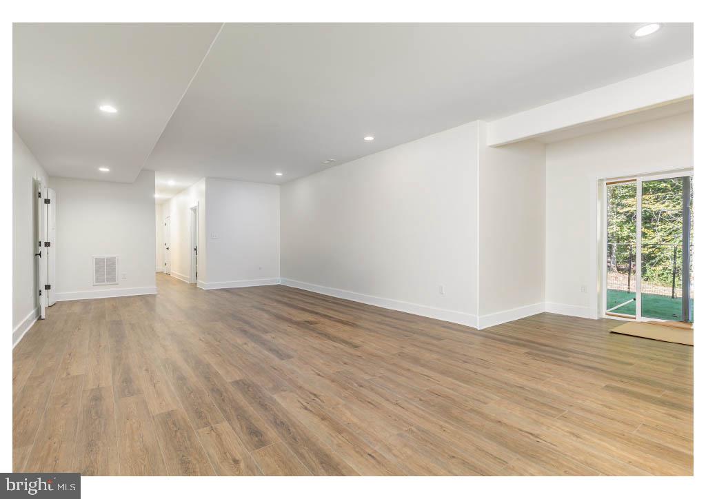 2 Windsor Drive King George, VA 22485 - Photo 59 of 60 a view of an empty room with wooden floor and a window
