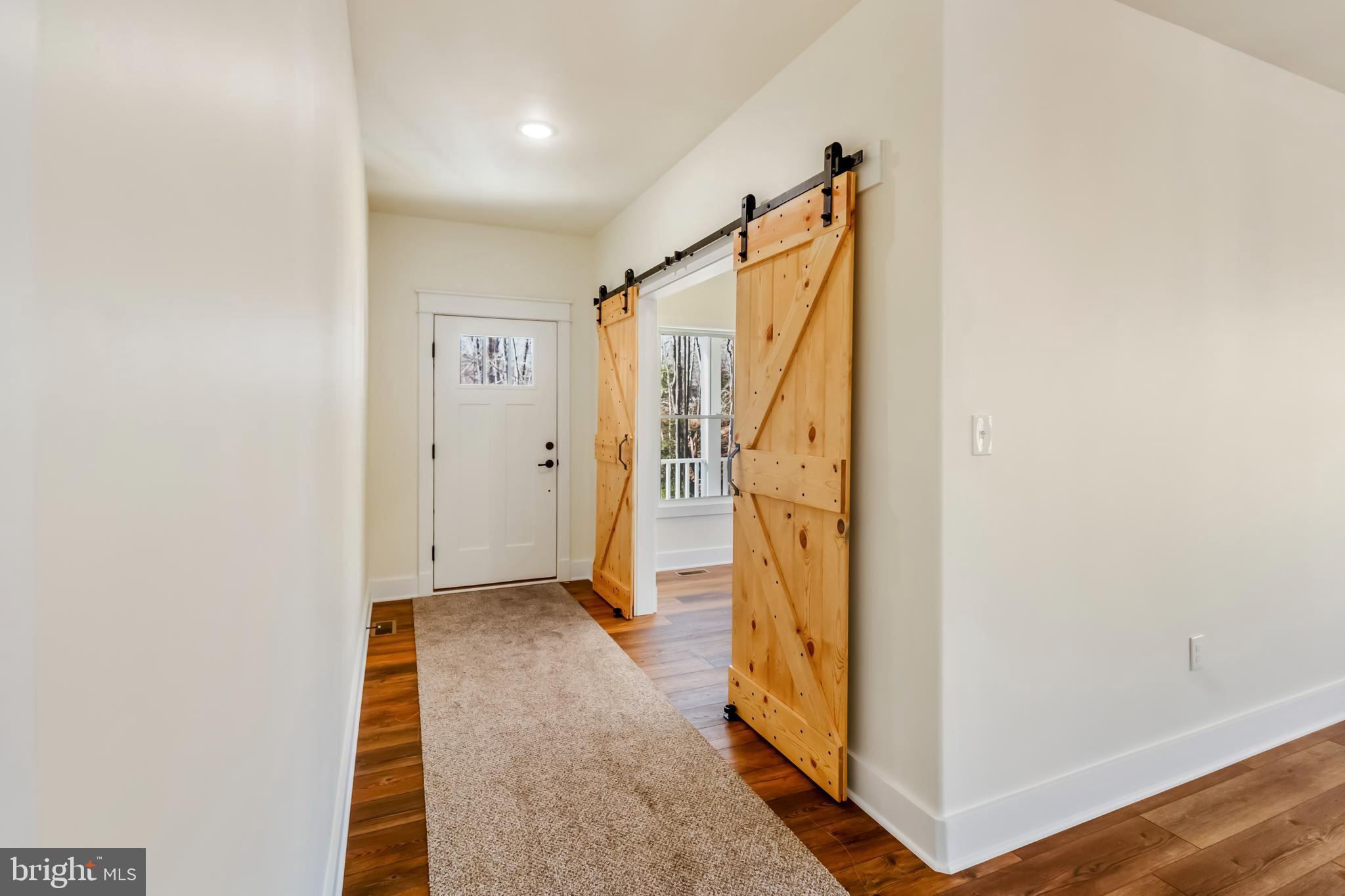 2 Windsor Drive King George, VA 22485 - Photo 6 of 60 a view of hallway with stairs and wooden floor