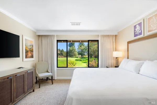 a view of a room with a large window