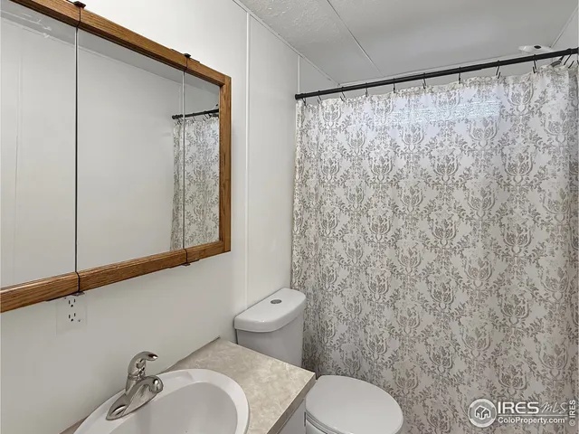 a bathroom with a toilet and a sink