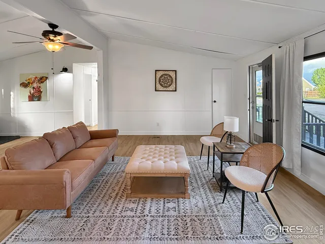 a living room with furniture and a rug