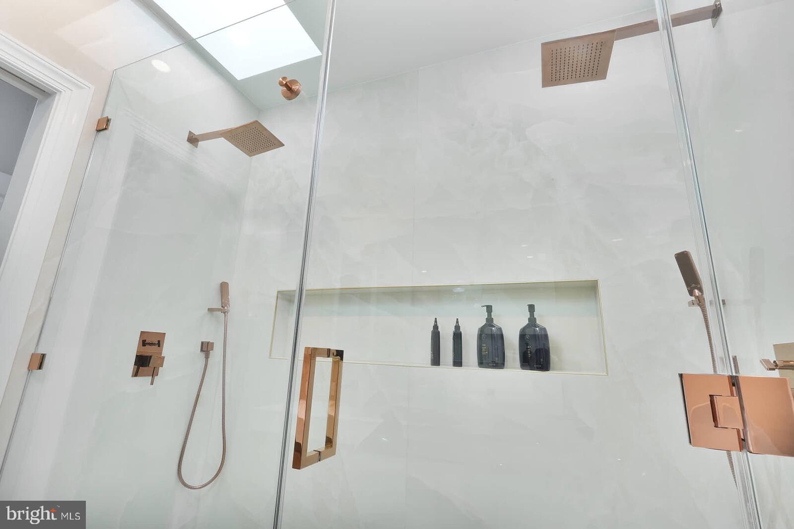 3332 Dent Place Northwest Washington, DC 20007 - Photo 16 of 46 Sleek modern shower with elegant fixtures.