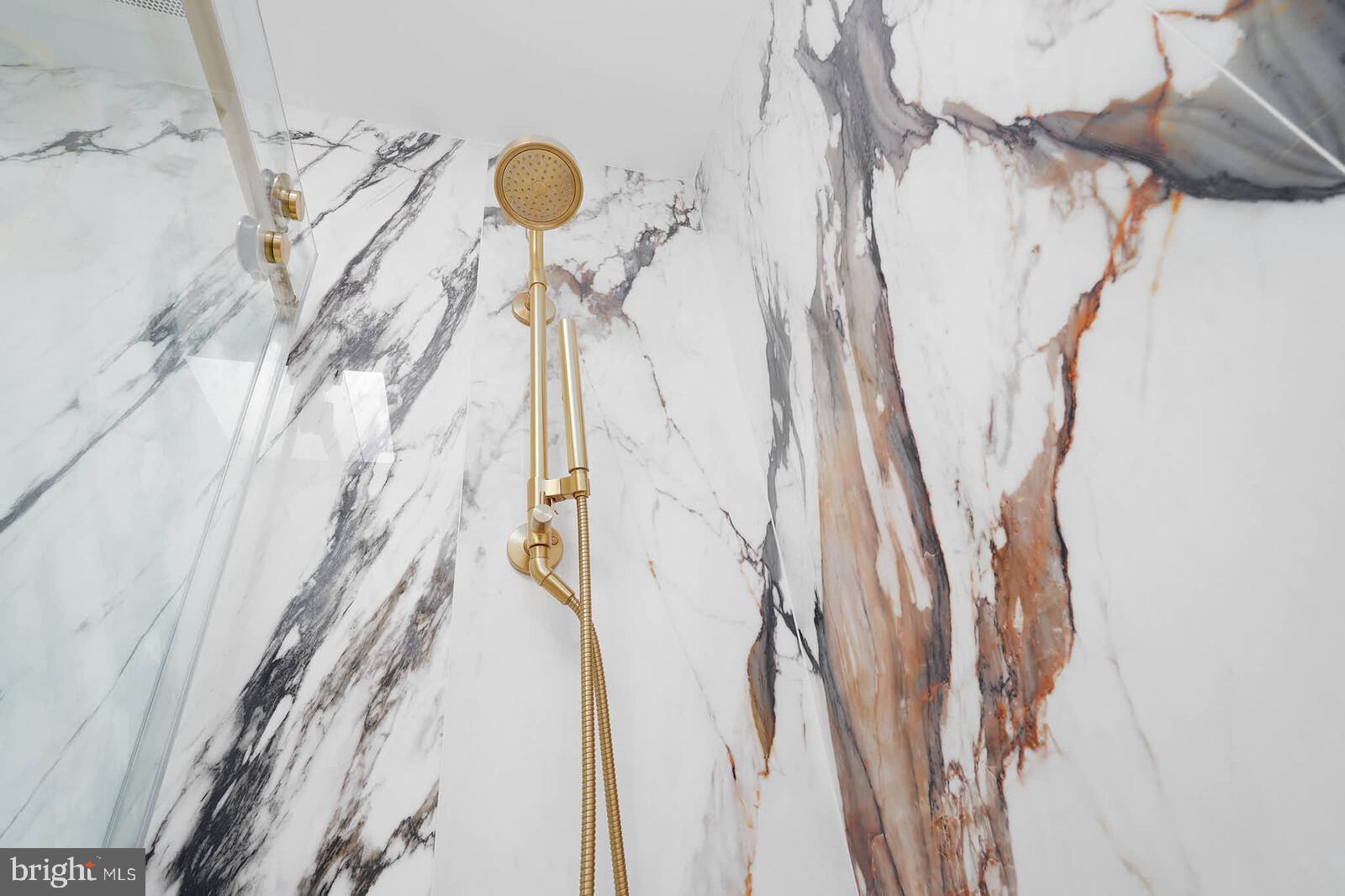 3332 Dent Place Northwest Washington, DC 20007 - Photo 22 of 46 Elegant marble shower with gold accents.