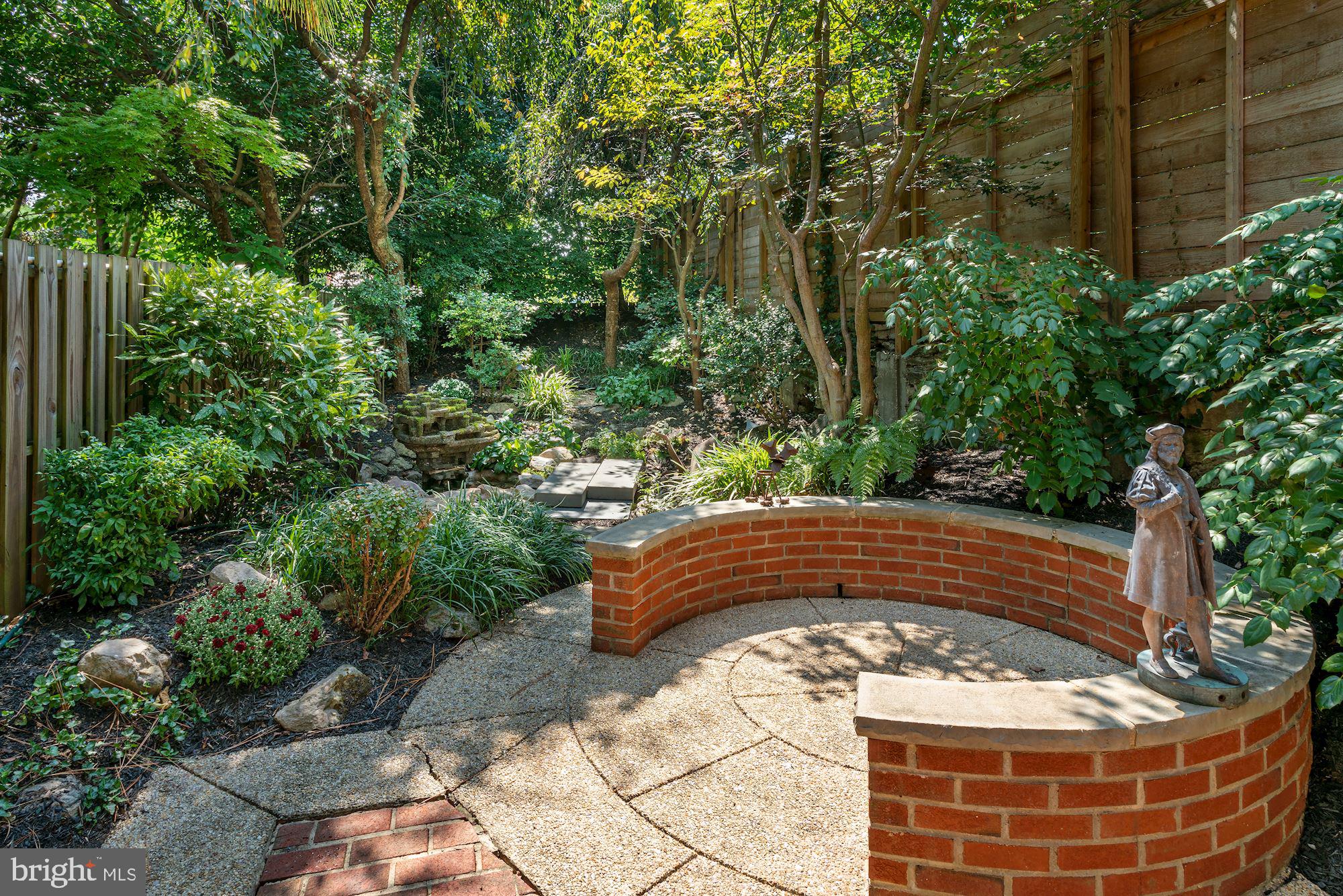 3332 Dent Place Northwest Washington, DC 20007 - Photo 3 of 46 Serene garden retreat with stone seating.