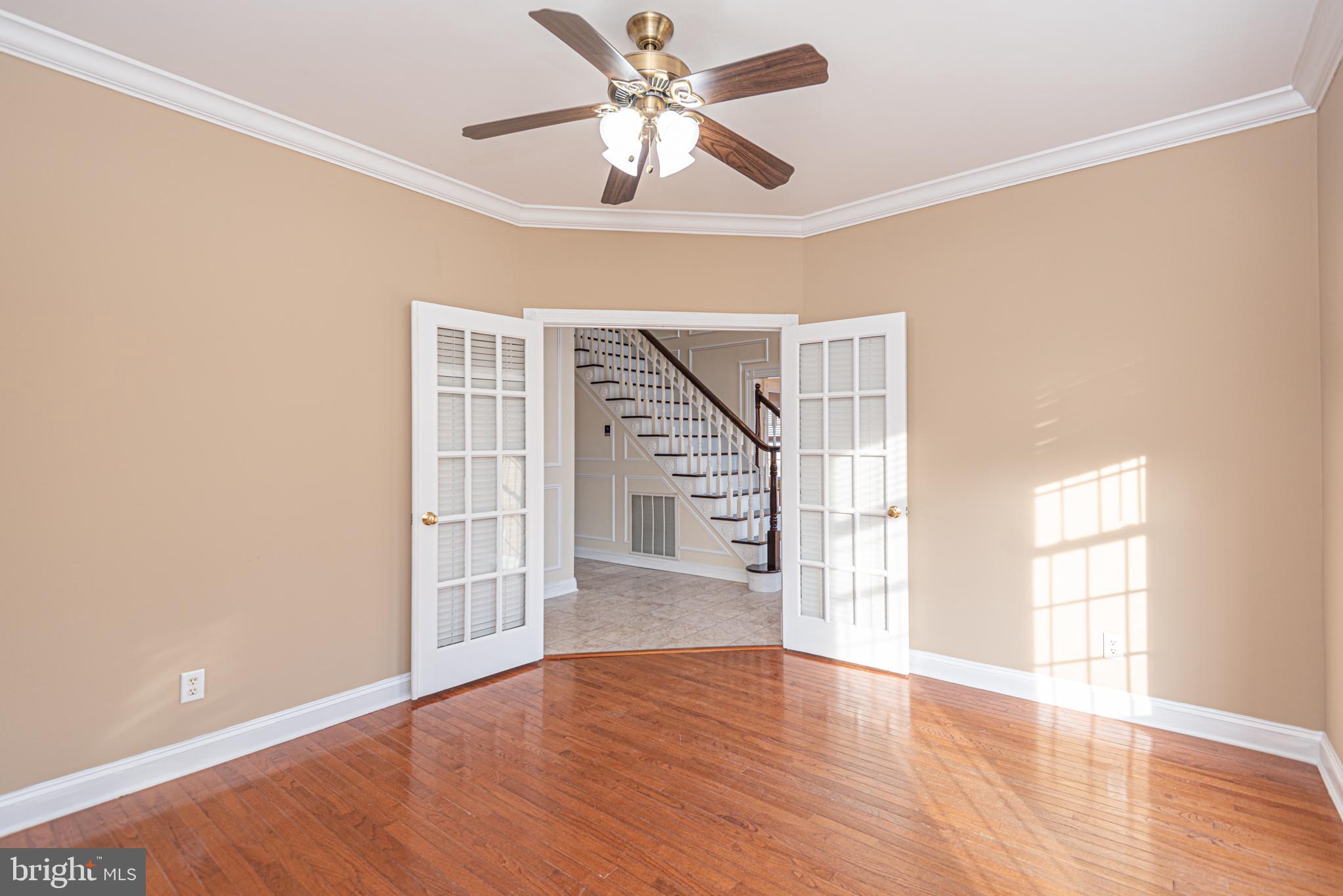 12004 Turtle Mill Road Bishopville, MD 21813 - Photo 16 of 69 a view of an empty room with a window and wooden floor