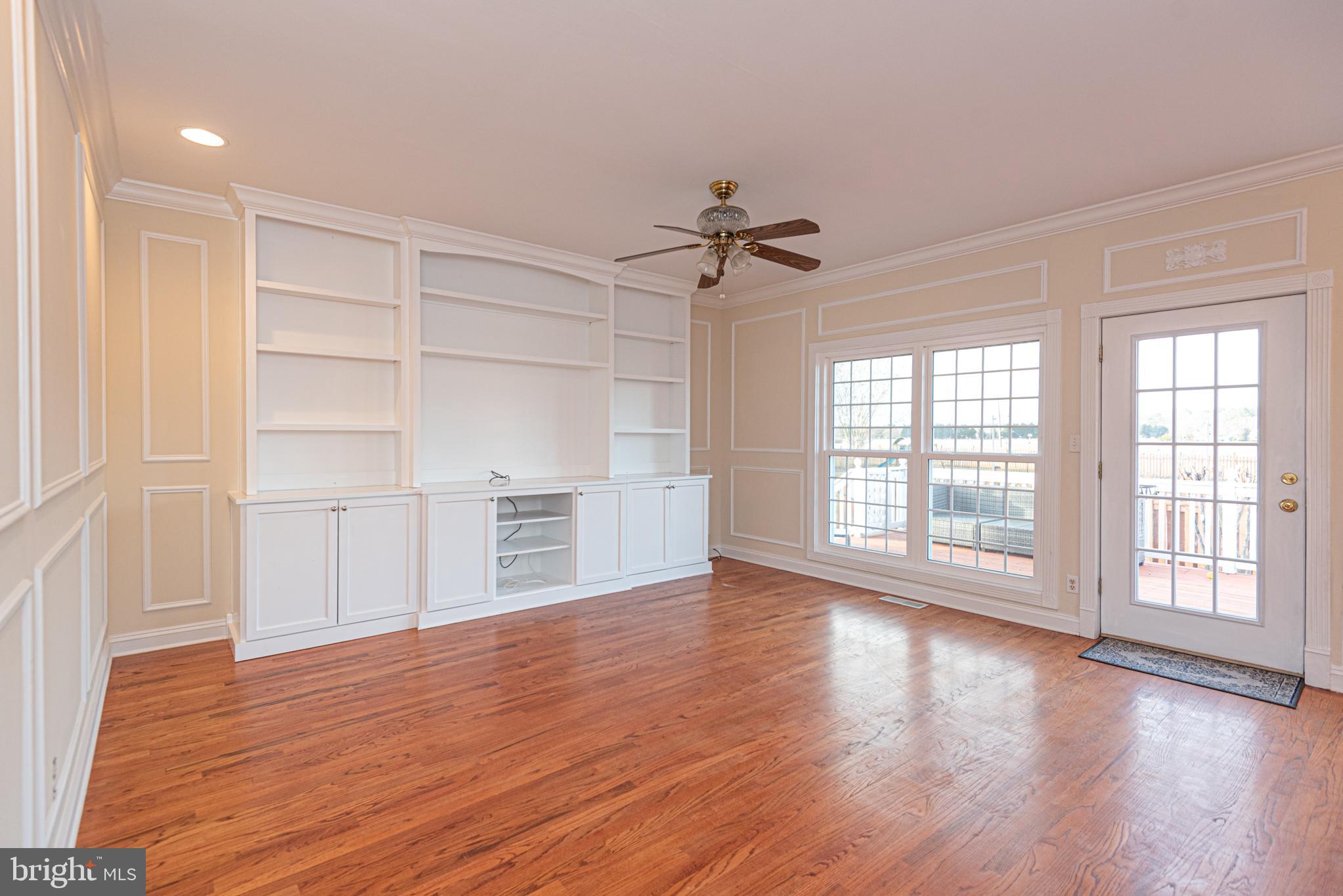 12004 Turtle Mill Road Bishopville, MD 21813 - Photo 25 of 69 a view of an empty room with a window and wooden floor
