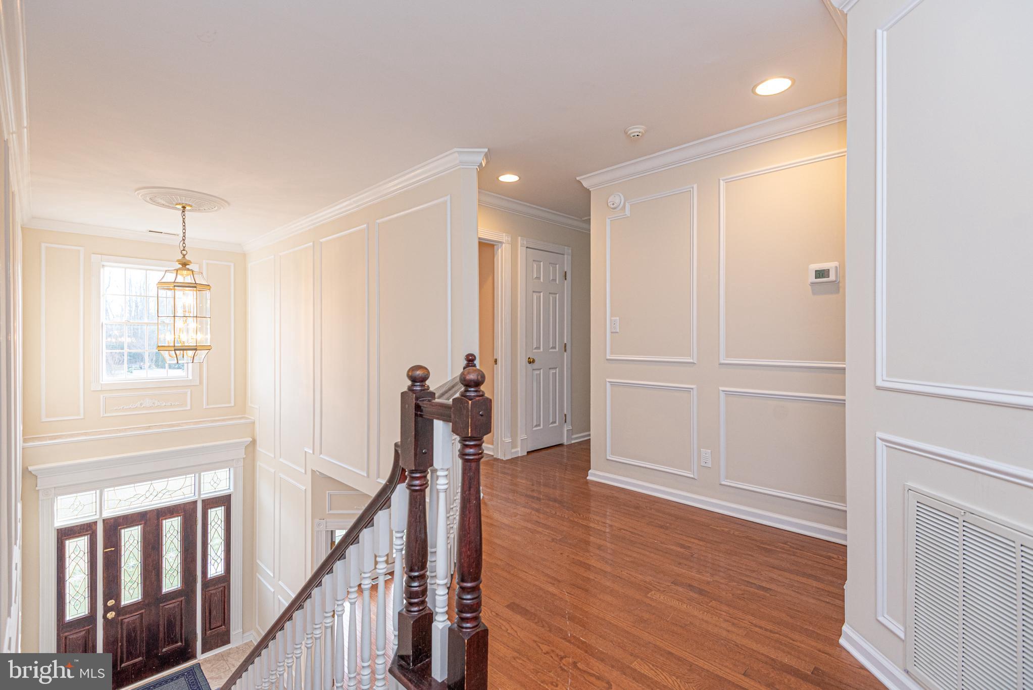 12004 Turtle Mill Road Bishopville, MD 21813 - Photo 38 of 69 a view of a hallway with wooden floor and staircase