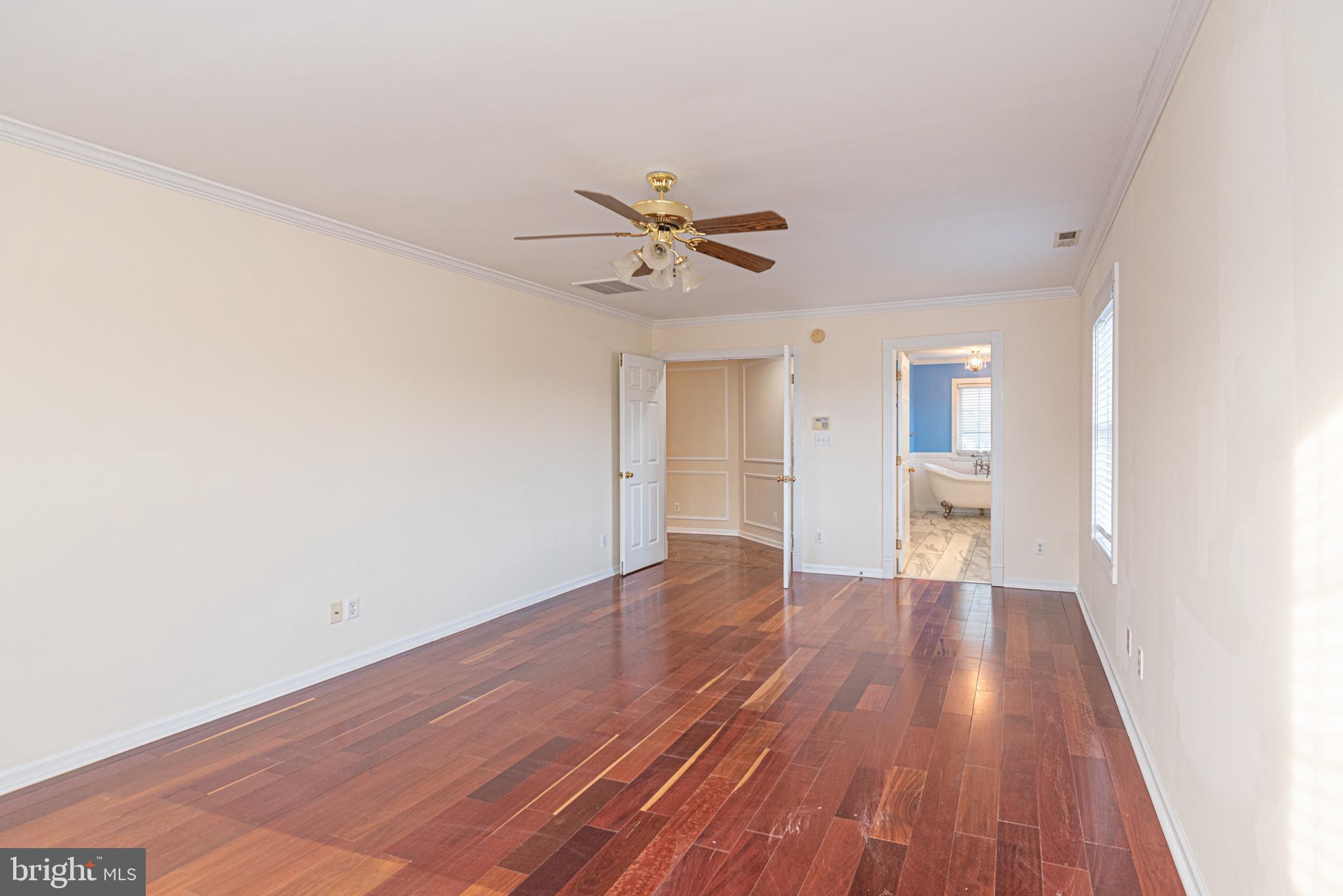12004 Turtle Mill Road Bishopville, MD 21813 - Photo 41 of 69 wooden floor in an empty room with a window
