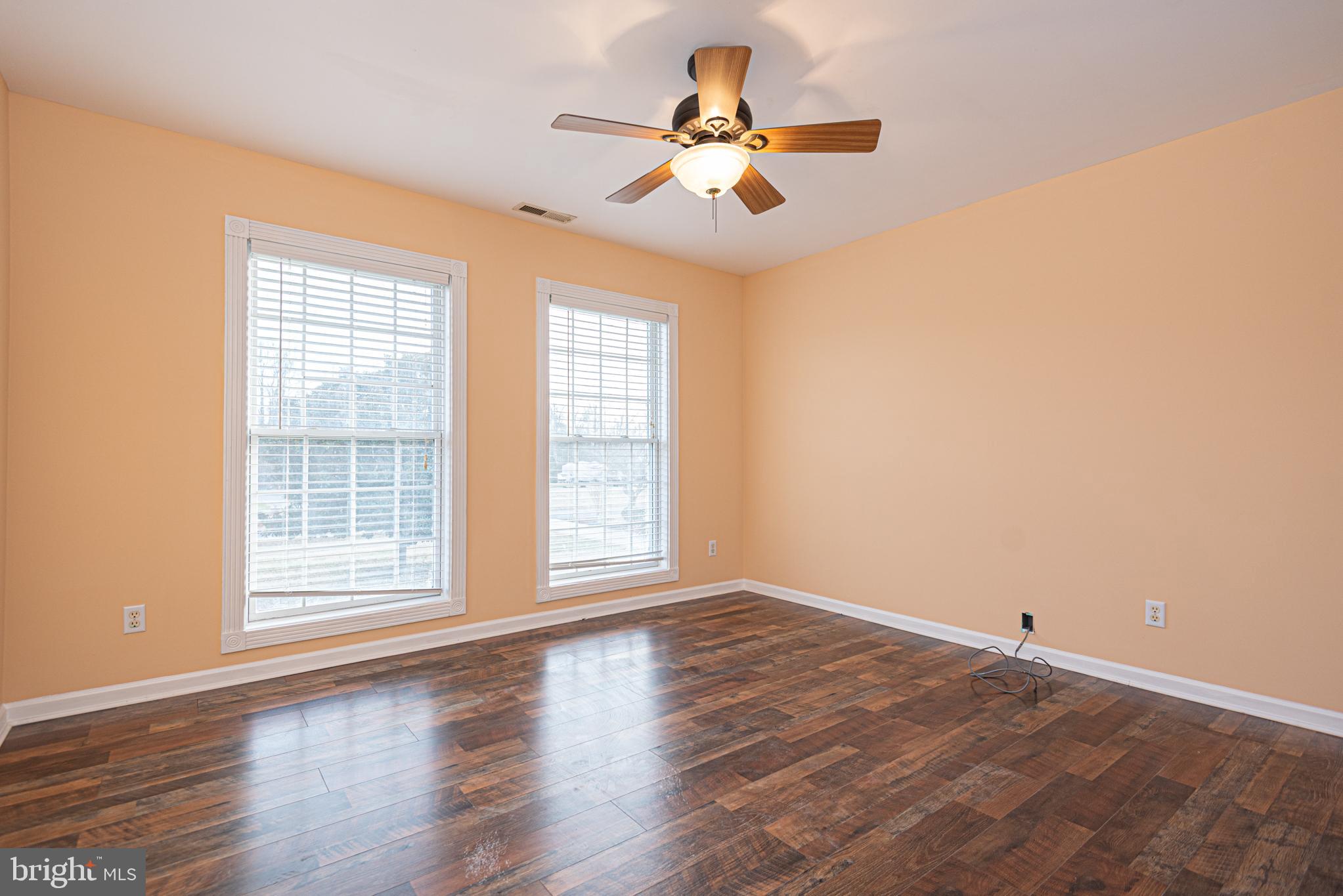 12004 Turtle Mill Road Bishopville, MD 21813 - Photo 50 of 69 an empty room with wooden floor and windows