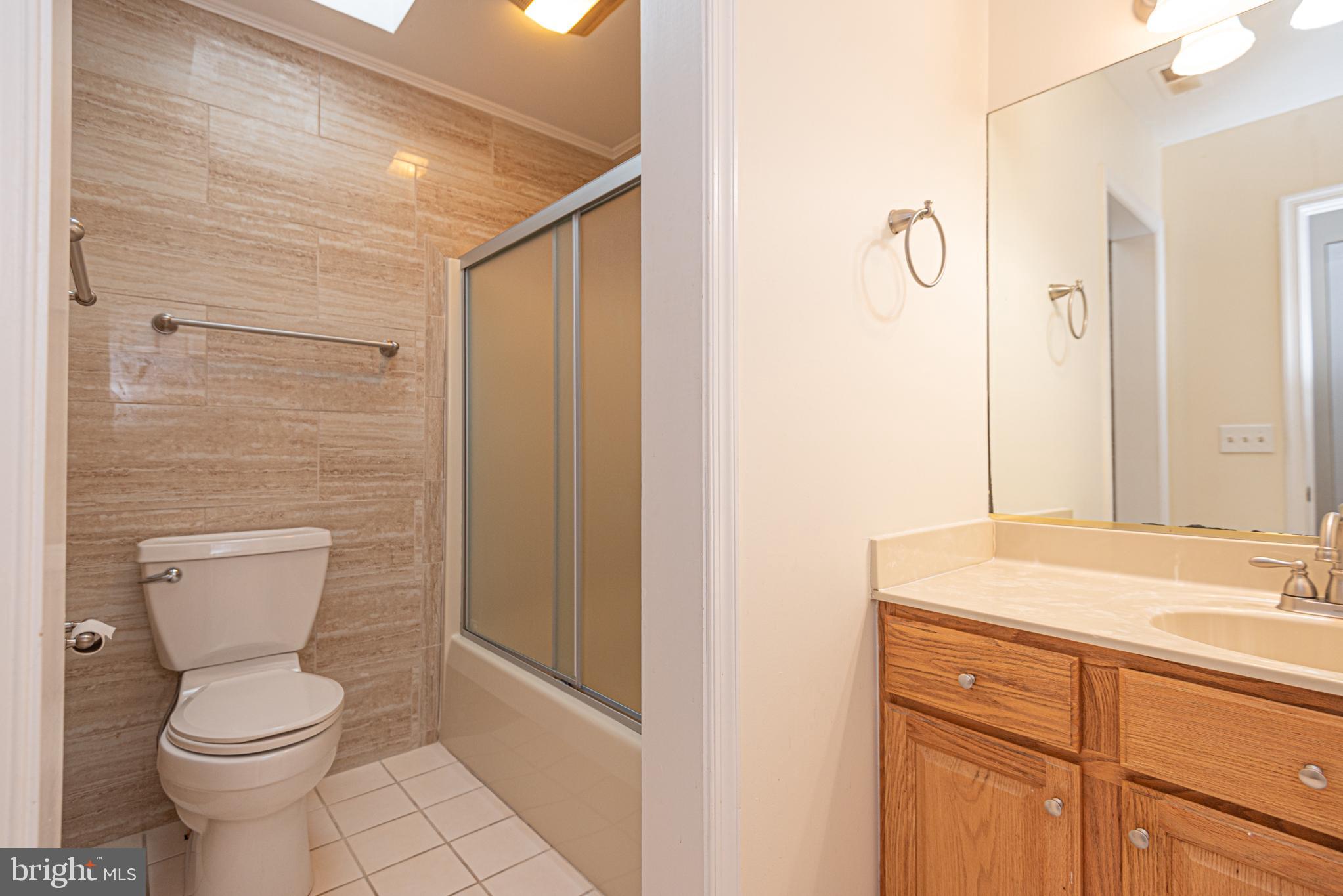 12004 Turtle Mill Road Bishopville, MD 21813 - Photo 56 of 69 a bathroom with a sink a toilet and shower
