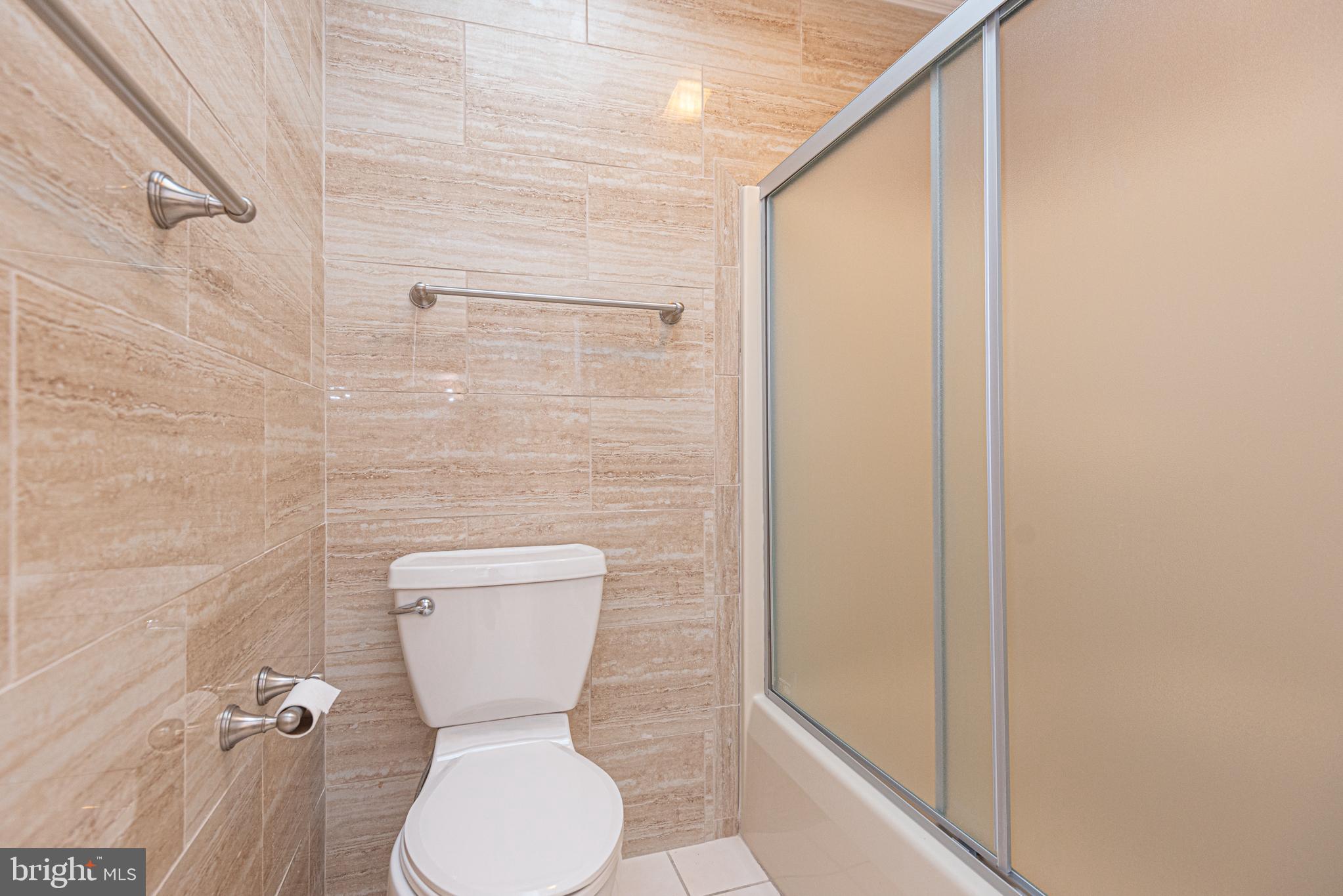 12004 Turtle Mill Road Bishopville, MD 21813 - Photo 57 of 69 a bathroom with a toilet a sink and a shower