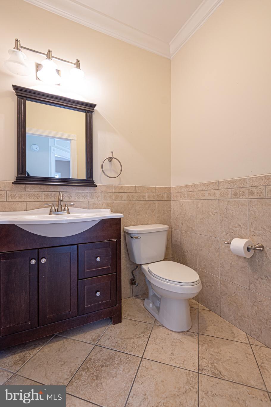 12004 Turtle Mill Road Bishopville, MD 21813 - Photo 60 of 69 a bathroom with a toilet sink and mirror
