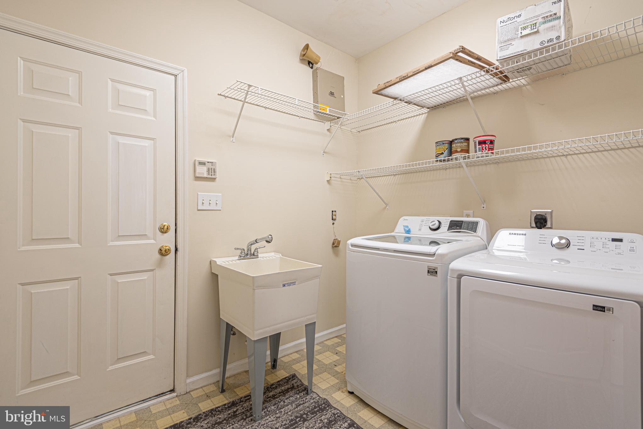 12004 Turtle Mill Road Bishopville, MD 21813 - Photo 61 of 69 a view of storage and utility room with washer and dryer