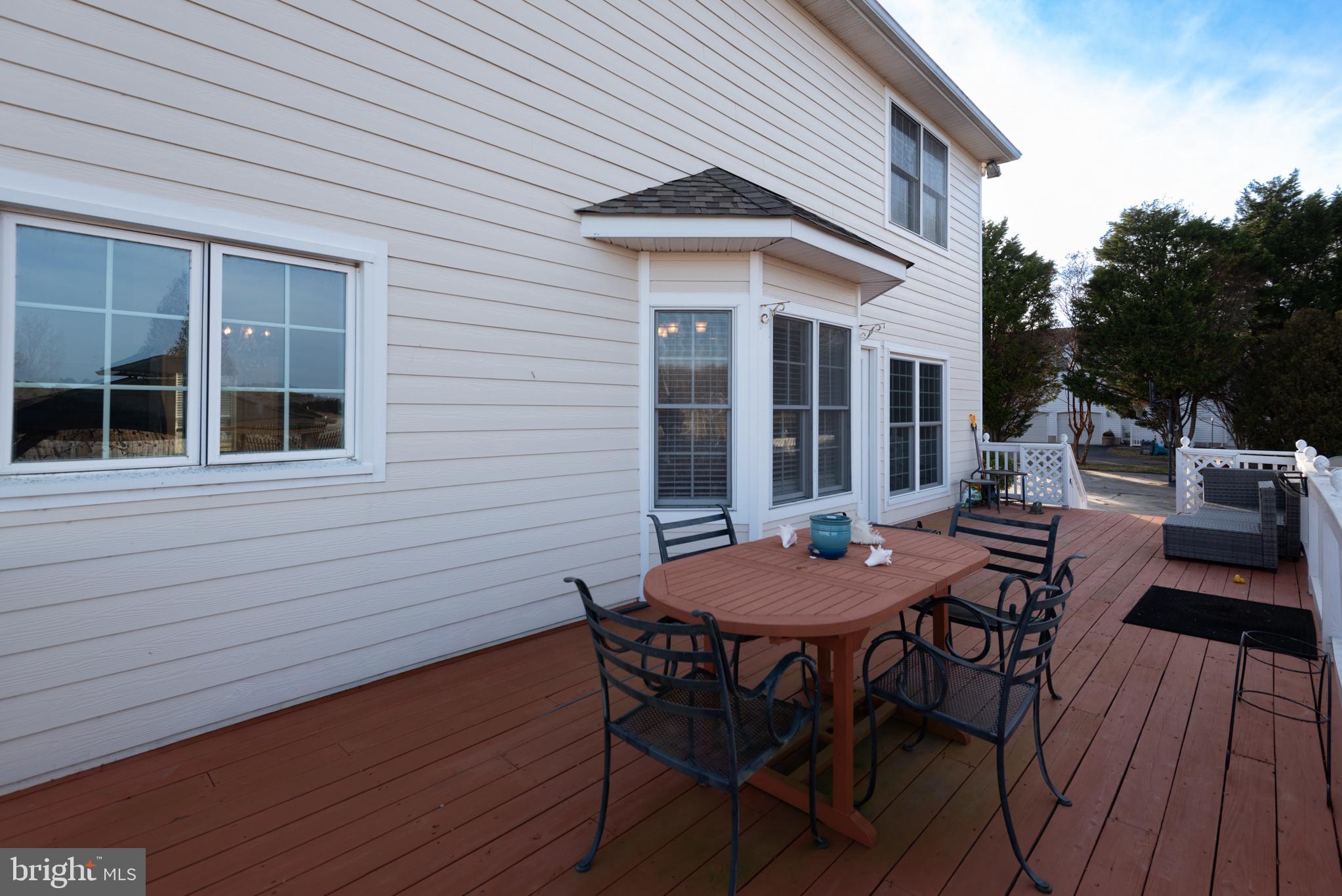 12004 Turtle Mill Road Bishopville, MD 21813 - Photo 7 of 69 a table and chairs in front of a house