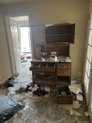 a kitchen with a sink and a stove top oven