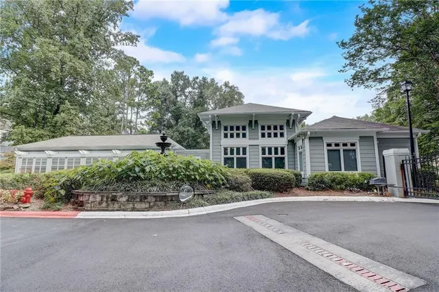 a front view of a house with a yard and outdoor seating