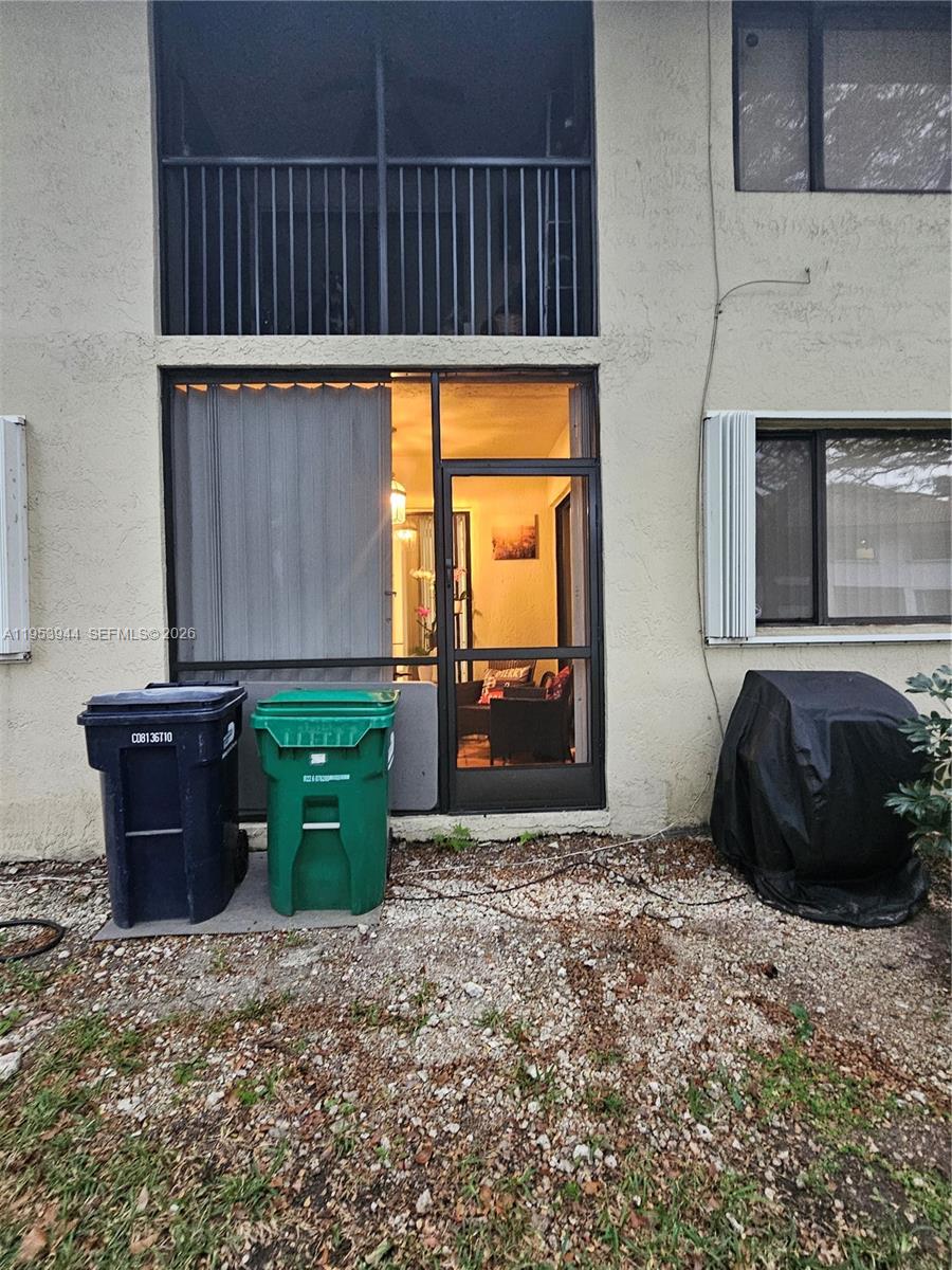 9781 Southwest 138th Avenue, Unit DB1R Miami, FL 33186 - Photo 16 of 16 a view of a car garage with a fireplace