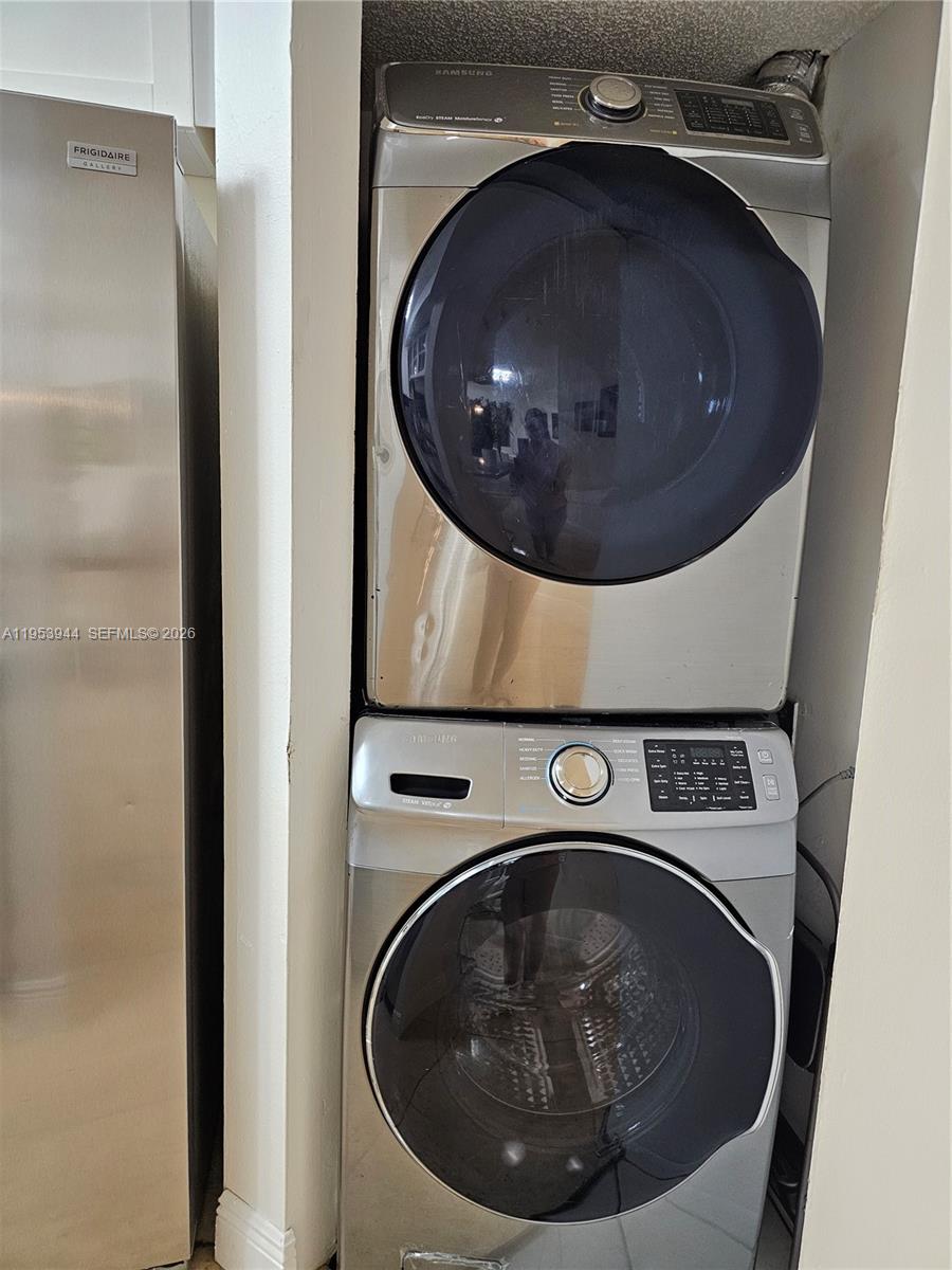 9781 Southwest 138th Avenue, Unit DB1R Miami, FL 33186 - Photo 6 of 16 a utility room with dryer and washer