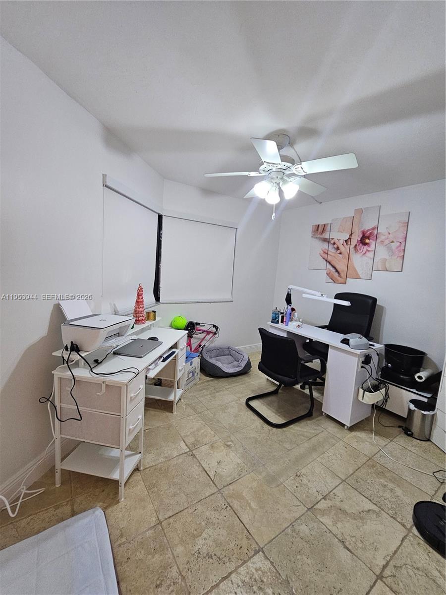 9781 Southwest 138th Avenue, Unit DB1R Miami, FL 33186 - Photo 10 of 16 a living room with furniture and a chandelier