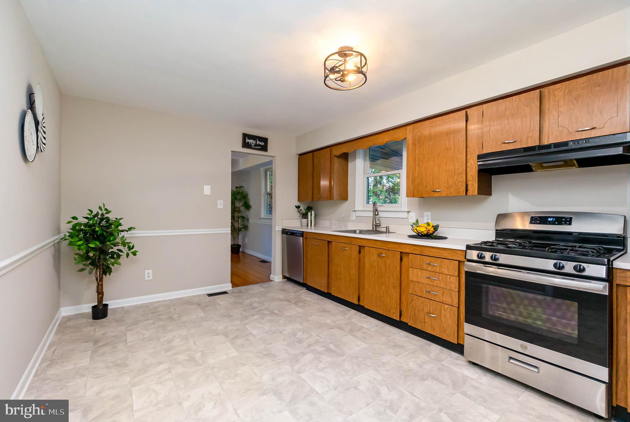 409 Fieldstone Court Fallston, MD 21047 - Photo 11 of 53 a kitchen with a stove a sink and a stove