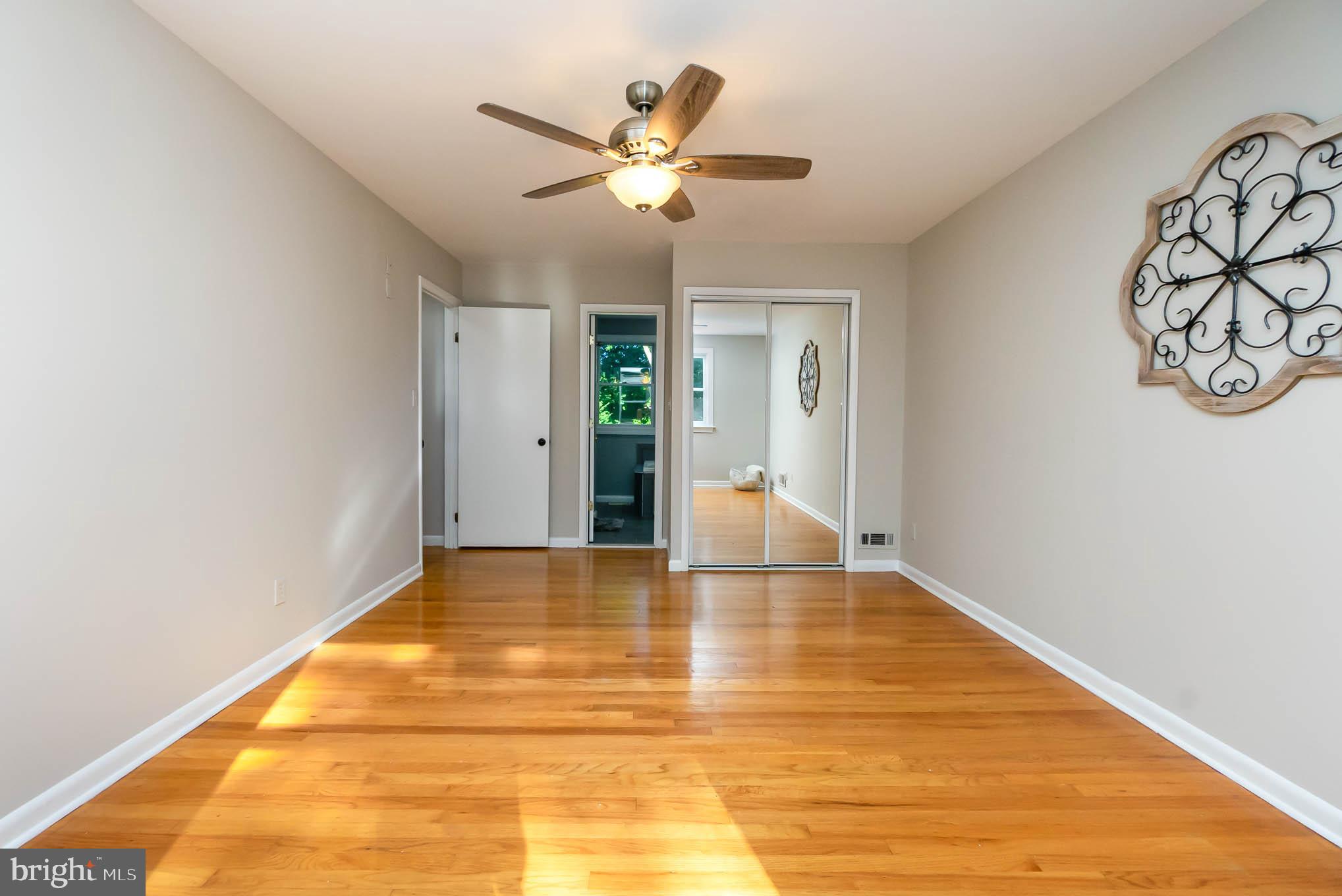 409 Fieldstone Court Fallston, MD 21047 - Photo 19 of 53 a view of an empty room with wooden floor