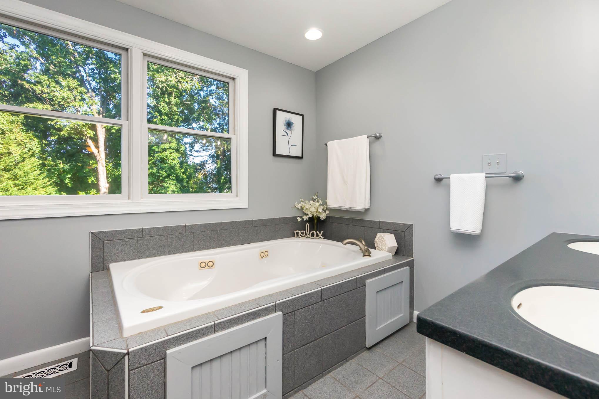 409 Fieldstone Court Fallston, MD 21047 - Photo 21 of 53 a bathroom with a tub sink and mirror