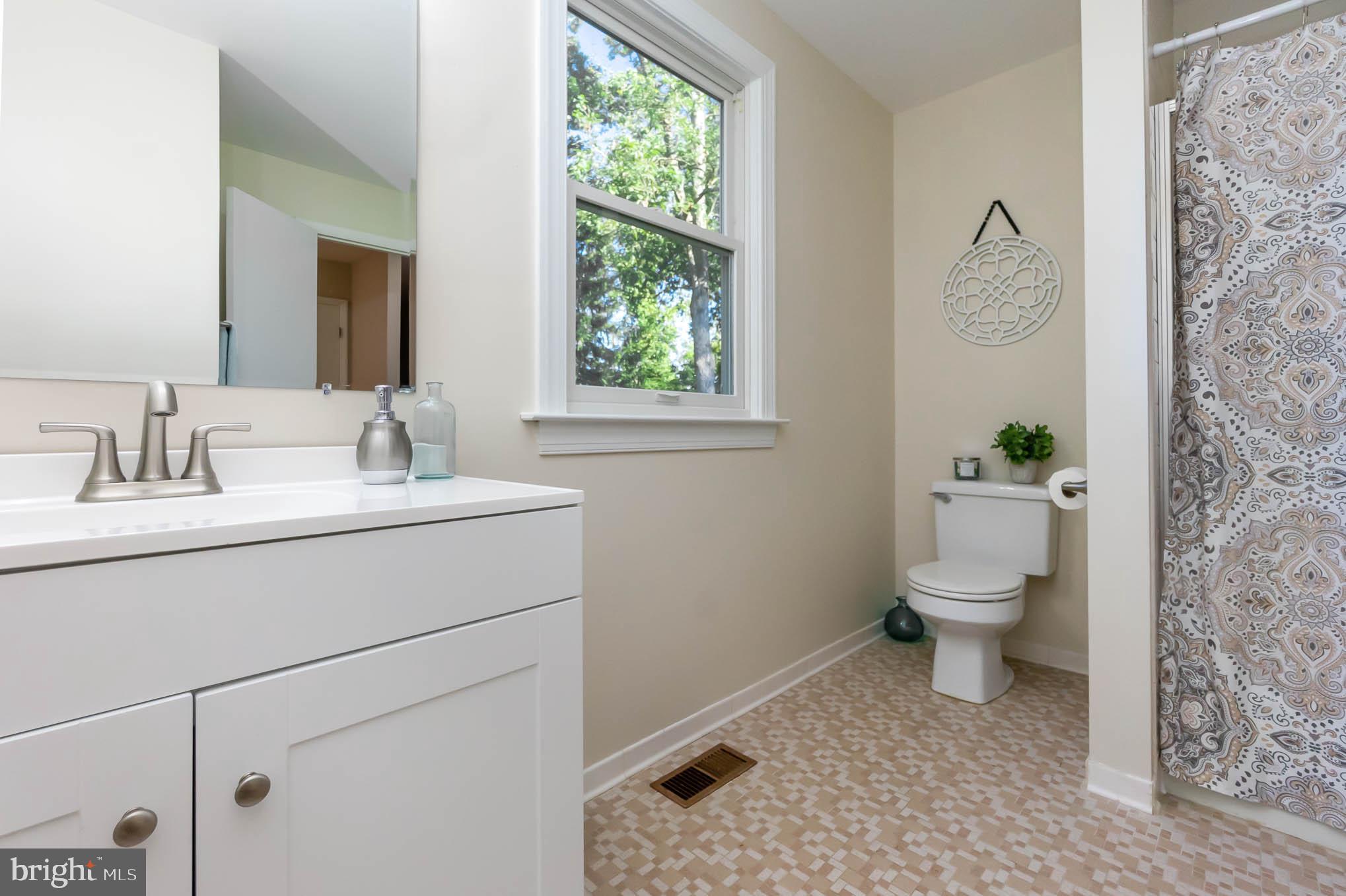 409 Fieldstone Court Fallston, MD 21047 - Photo 28 of 53 a bathroom with a sink toilet and a window