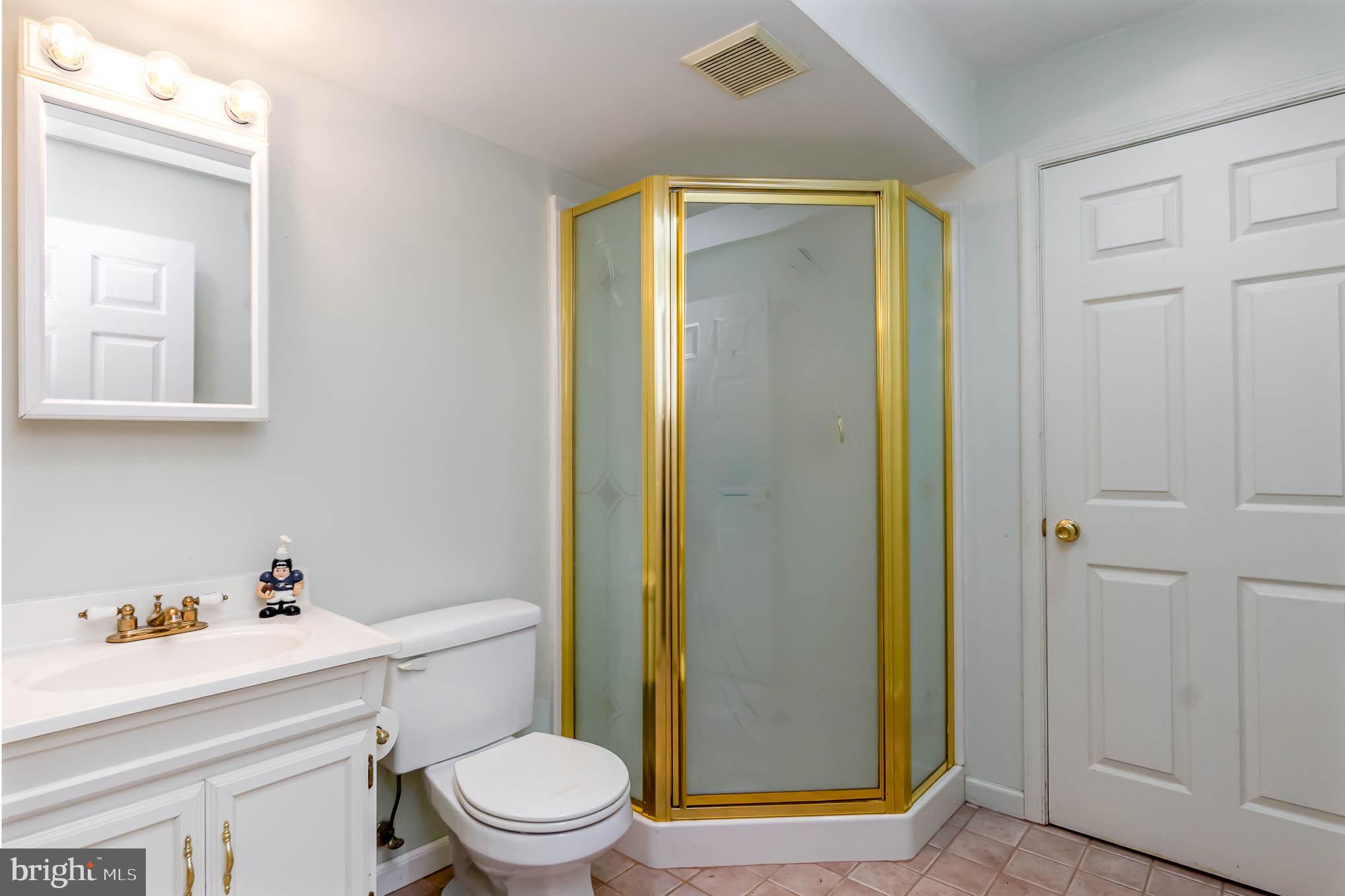 409 Fieldstone Court Fallston, MD 21047 - Photo 36 of 53 a bathroom with a sink a toilet and shower