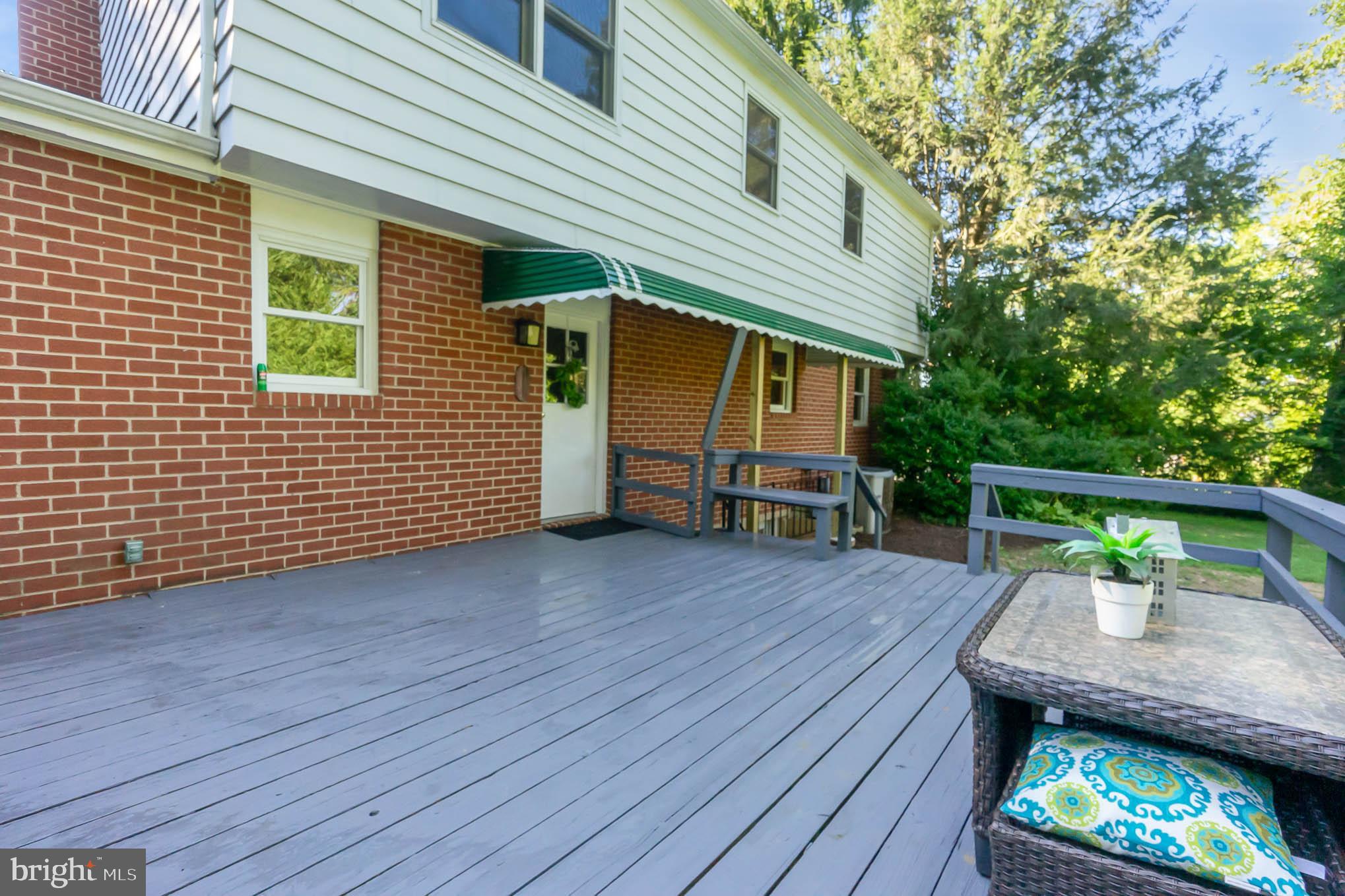 409 Fieldstone Court Fallston, MD 21047 - Photo 38 of 53 a view of house with deck outdoor seating and covered with wooden floor