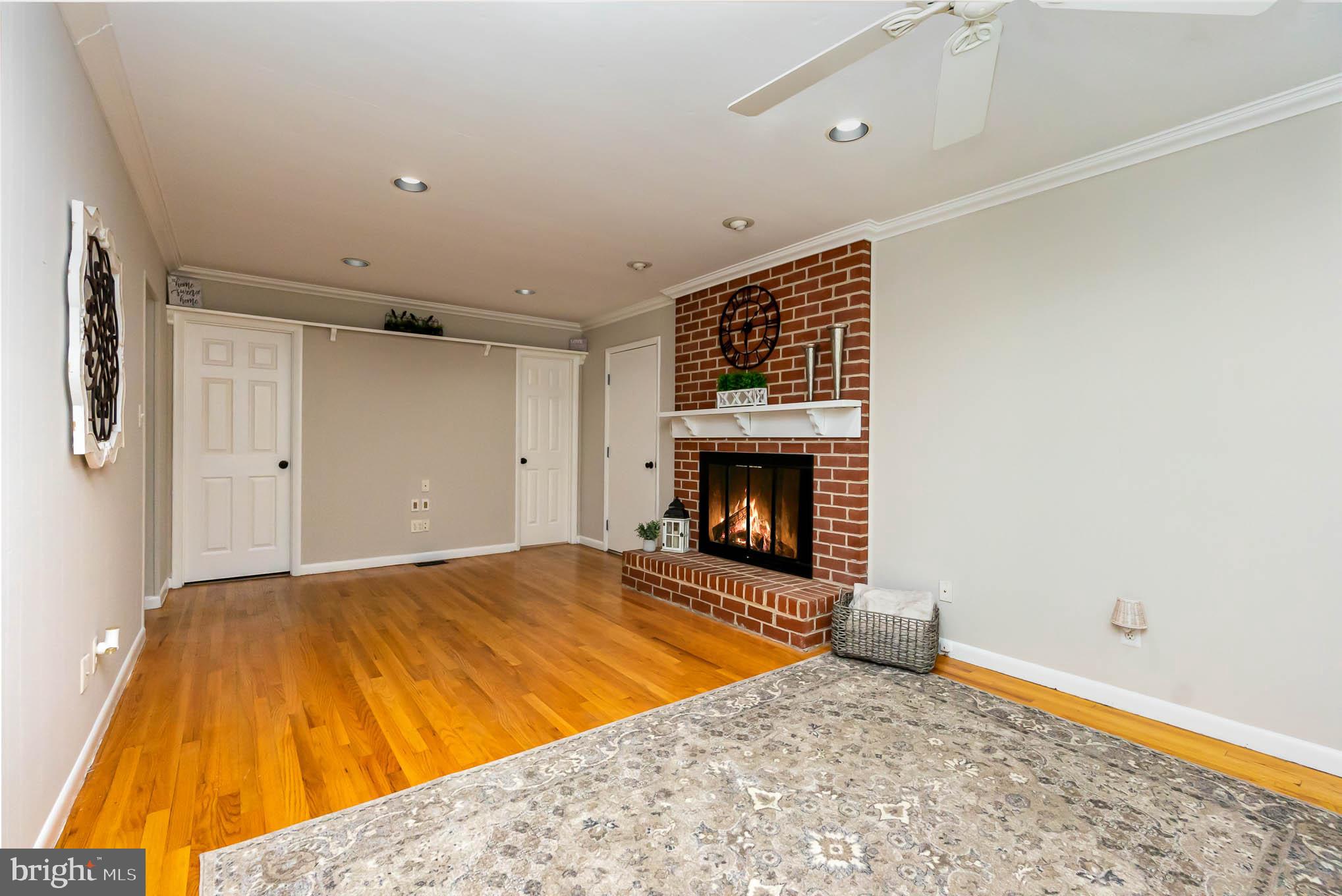 409 Fieldstone Court Fallston, MD 21047 - Photo 8 of 53 a view of empty room with wooden floor and fireplace