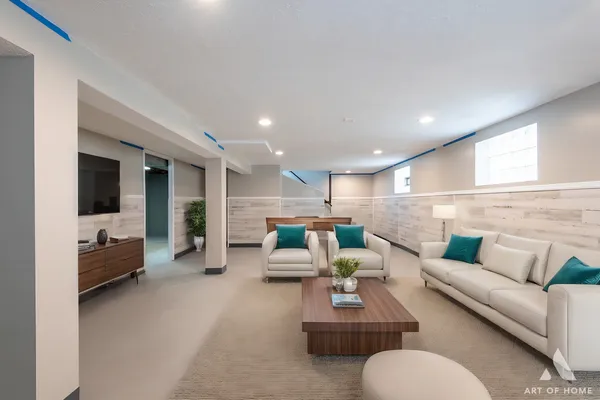 a living room with furniture and a large window