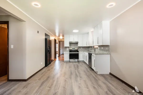 a view of kitchen with wooden floor