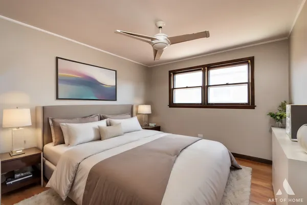 a bedroom with a large bed and a window