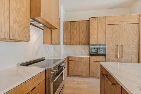 a kitchen with a sink and cabinets