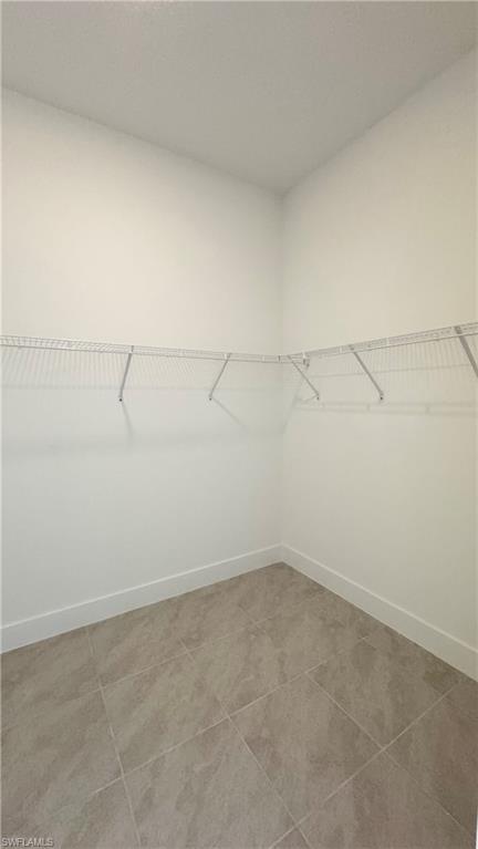 5105 Penella Ave Ave Avenue Immokalee, FL 34142 - Photo 10 of 37 a view of a room with racks on the wall