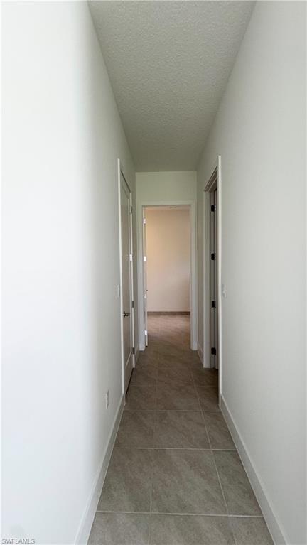 5105 Penella Ave Ave Avenue Immokalee, FL 34142 - Photo 11 of 37 a view of a hallway with closet