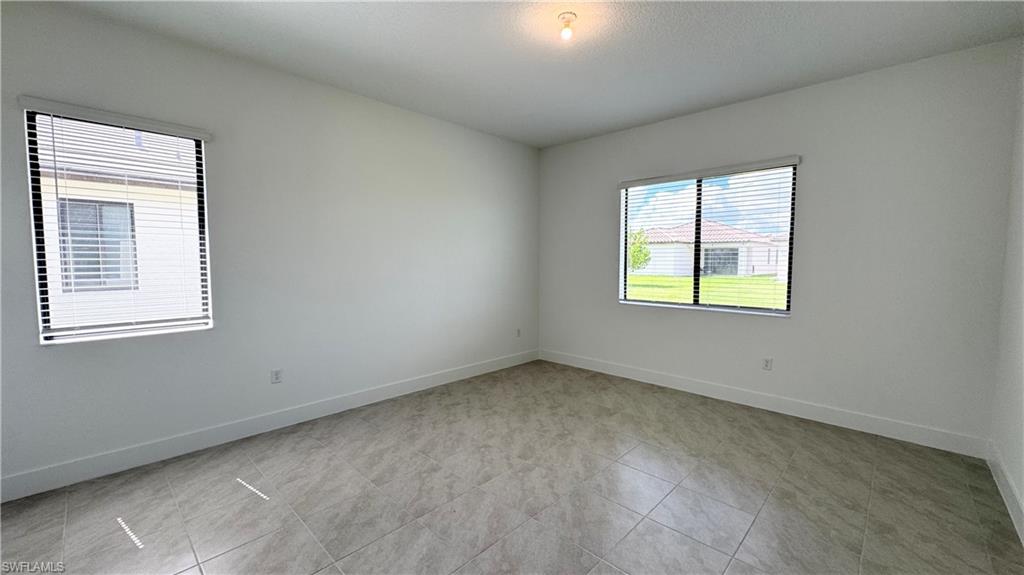 5105 Penella Ave Ave Avenue Immokalee, FL 34142 - Photo 12 of 37 an empty room with a window