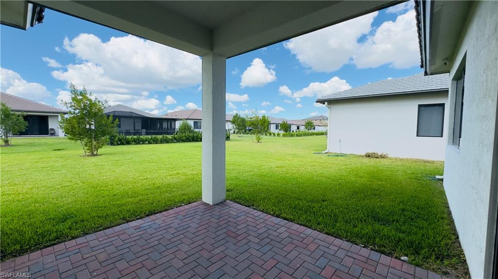 5105 Penella Ave Ave Avenue Immokalee, FL 34142 - Photo 17 of 37 a view of a porch with a yard